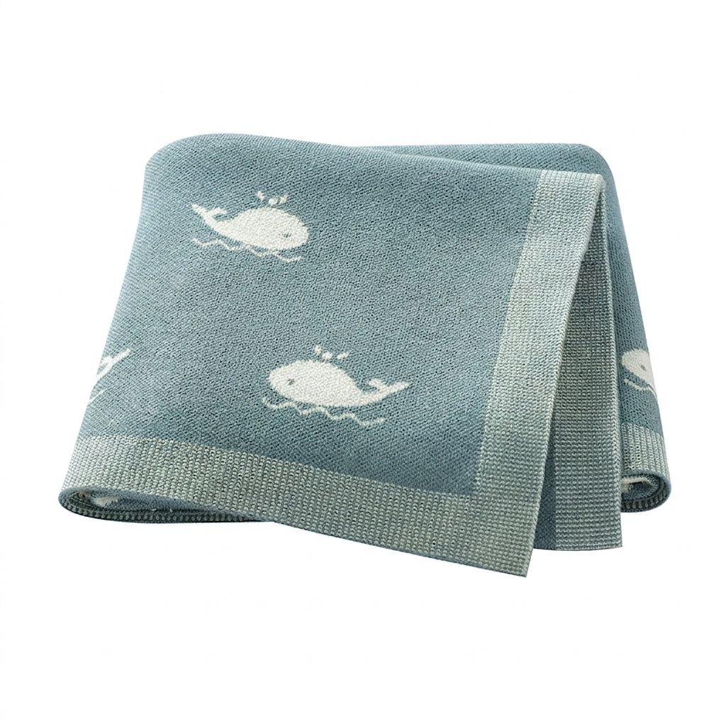 Kidsely soft knit baby blanket in teal with white whale pattern for ocean theme nursery