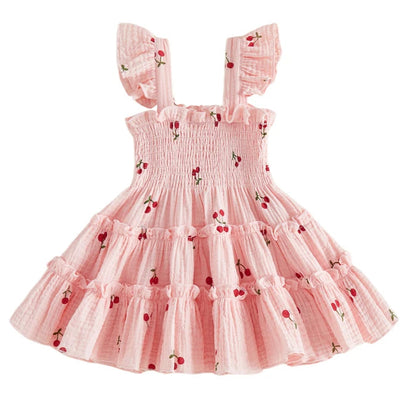 Kidsely Baby and Toddler Girl Smocked Cherry Summer Dress in Soft Rose pink with red cherry pattern and A-line tiered design.
