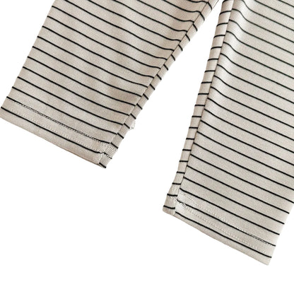 A close-up showing the bottom ankle hems and stripe pattern of the ribbed baby leggings.