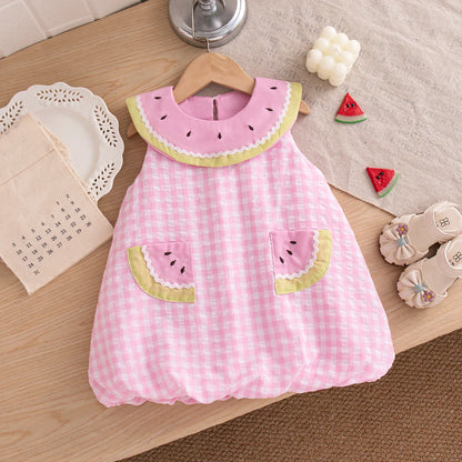 Close-up of the Summer Pink checkered bubble dress with decorative watermelon slice pockets and a matching pink statement collar.