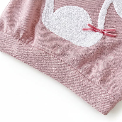 Zoomed-in macro shot of the textured white towel-stitch swan embroidery featuring a small pink velvet ribbon bow attached to the wing.