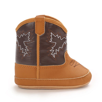 Side profile of a single tan and brown baby cowboy boot.
