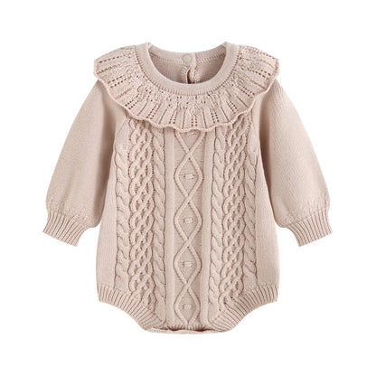 Taupe long sleeve cable knit ruffle romper for infant baby girls on a plain background.