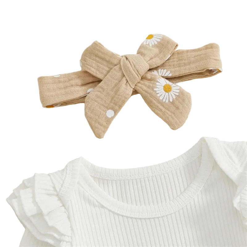Close-up of the matching taupe daisy print baby bow headband and the ruffle shoulder detail on the white ribbed bodysuit.