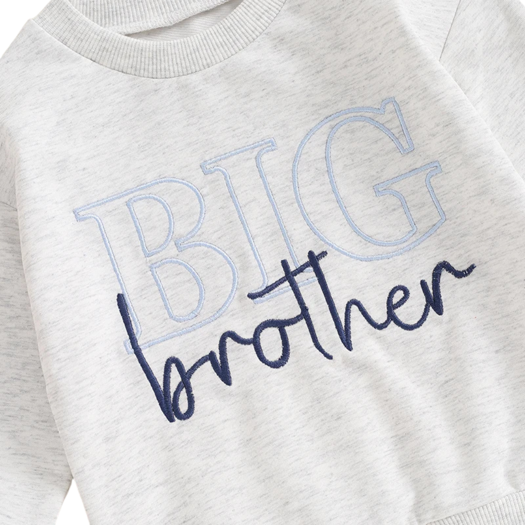 Close-up detail of the premium light blue outline and dark navy script Big Brother letter embroidery on a heather grey toddler sweatshirt.