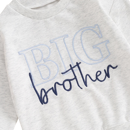 Close-up detail of the premium light blue outline and dark navy script Big Brother letter embroidery on a heather grey toddler sweatshirt.