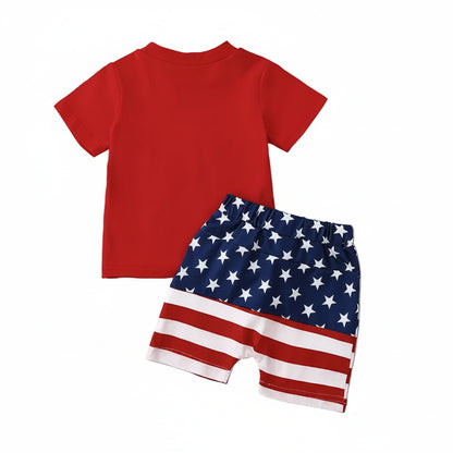Back view of the plain red short-sleeve t-shirt paired with the toddler boys' American flag shorts.