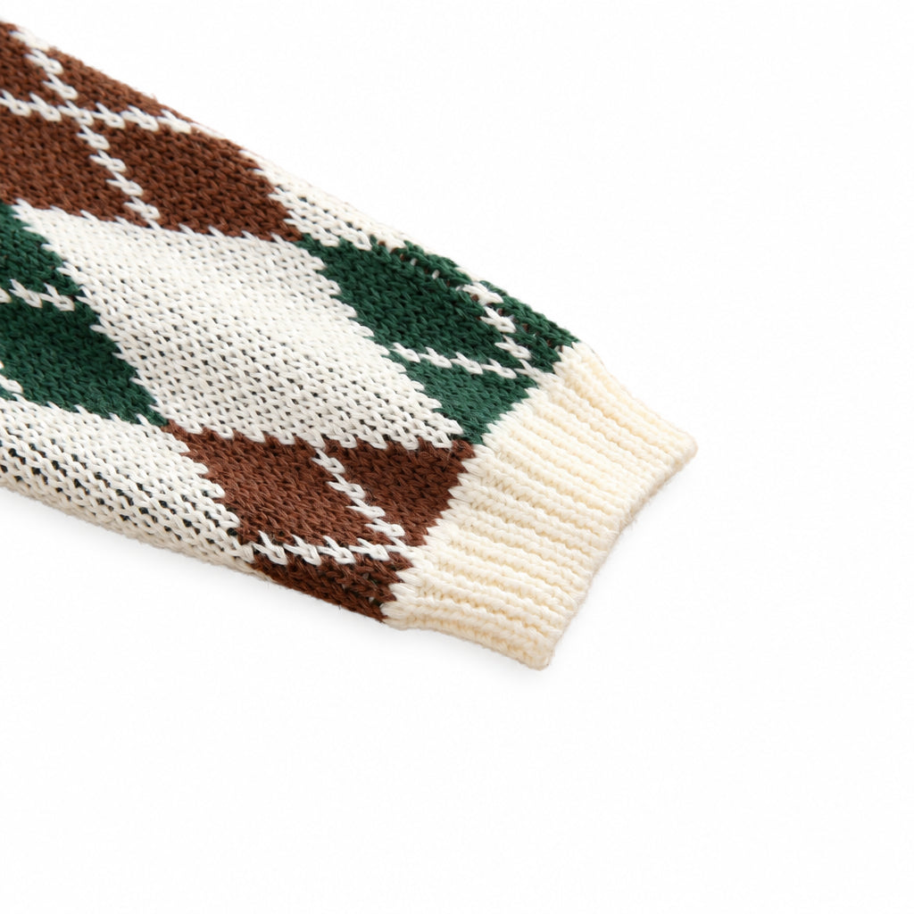 Detail of long sleeve and ribbed cuff on boys cotton argyle knit sweater