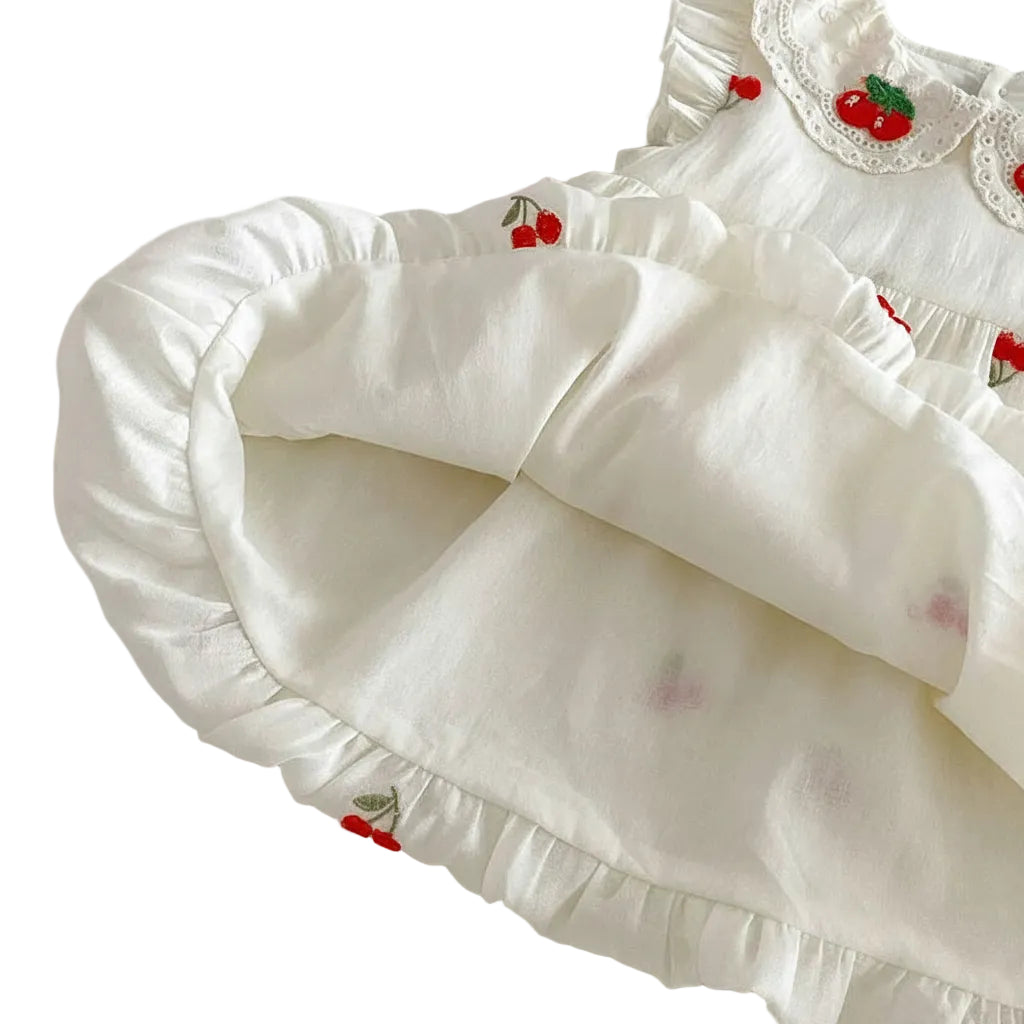 Interior view of the cherry bubble dress showing the soft cotton lining and elasticized hem.
