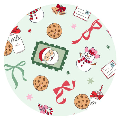 Close-up fabric swatch of Sweet Treats holiday print showing vintage Santa portraits, cookies, milk, snowmen, and candy cane bows