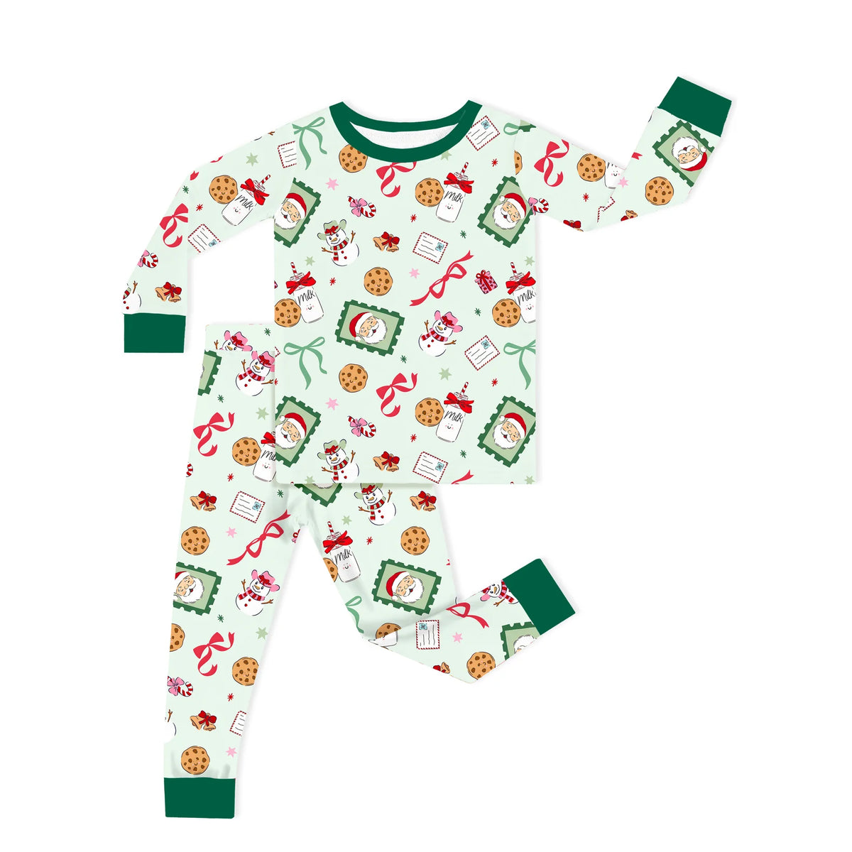 Two-piece toddler Christmas bamboo pajama set flat lay with Sweet Treats Santa and cookie print and dark green trim