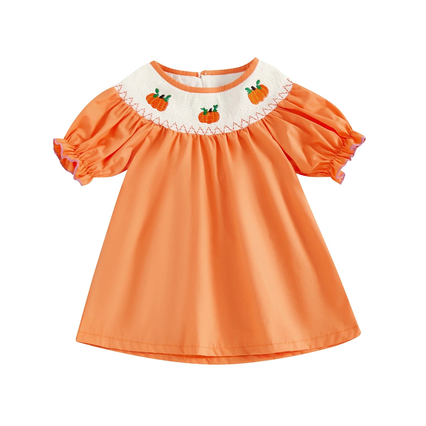 Solid orange smocked toddler dress featuring embroidered pumpkins along the neckline.