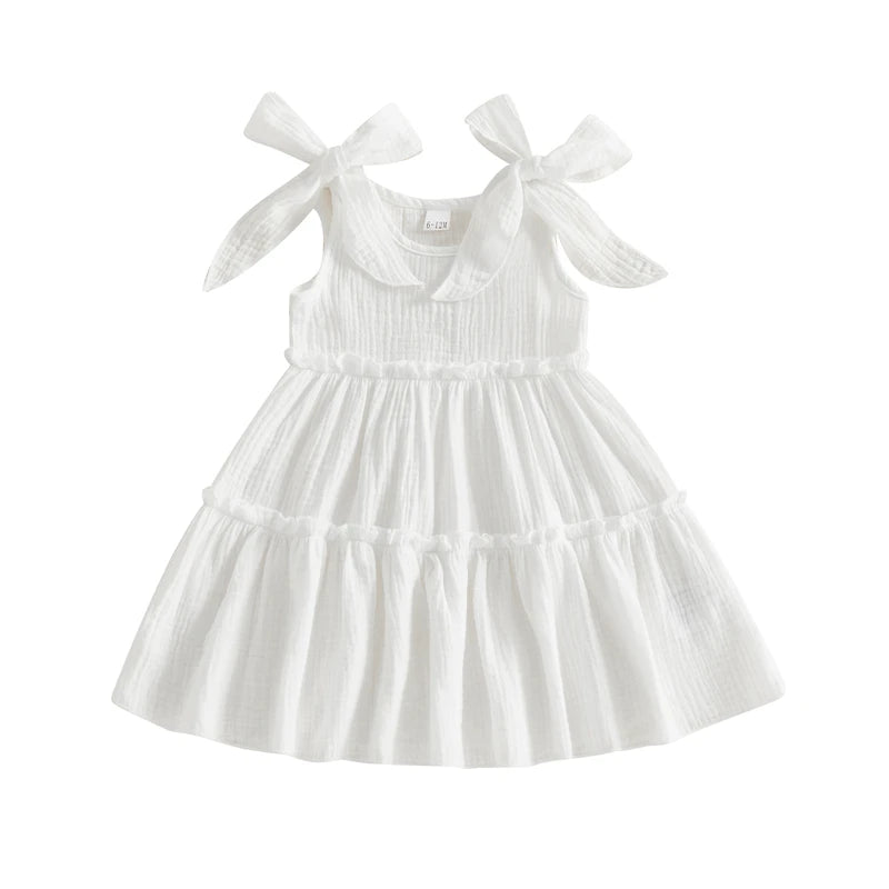Little girl's tiered sleeveless cotton cami sun dress with adjustable bow straps in Cloud White.