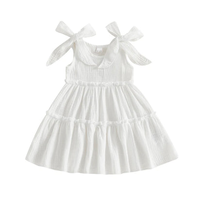 Little girl's tiered sleeveless cotton cami sun dress with adjustable bow straps in Cloud White.