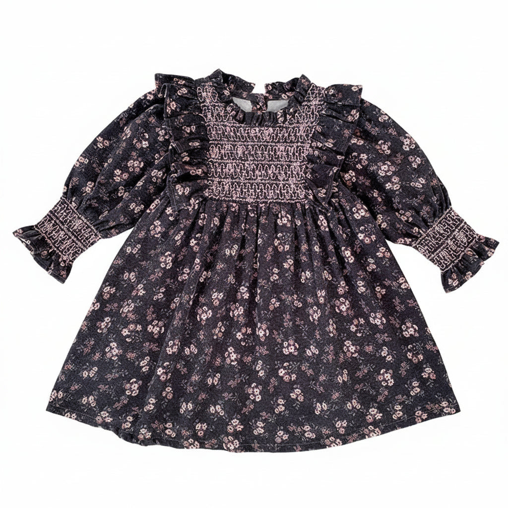 Toddler girls grey floral smocked long sleeve A-line dress with ruffle shoulders and smocked cuffs laid flat.