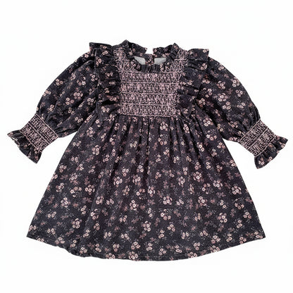 Toddler girls grey floral smocked long sleeve A-line dress with ruffle shoulders and smocked cuffs laid flat.