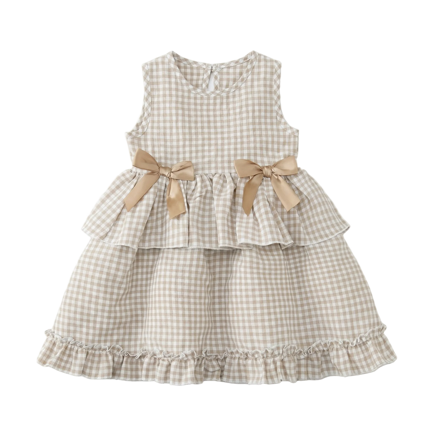 Flat lay of a toddler girls sleeveless gingham dress in Honey Gold tan and white checkered pattern, featuring tiered ruffled layers and two decorative satin bows on a neutral background.