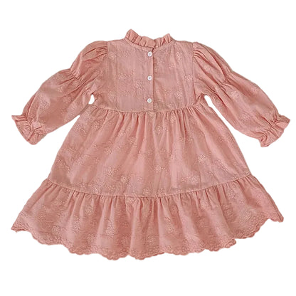 Back view flat lay of a toddler and girls pink floral embroidered tiered dress showing back button details.