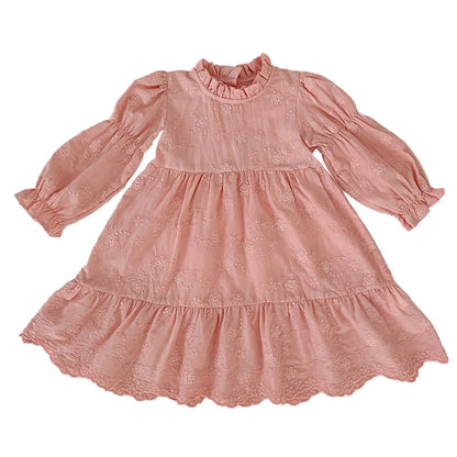 Front view flat lay of a toddler and girls pink floral embroidered long sleeve tiered dress with a scalloped hemline.