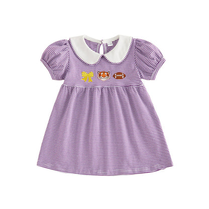 Front view of the toddler girls purple and white striped game day dress featuring a white Peter Pan collar and chest embroidery of a gold bow, tiger mascot, and a football on a white background.