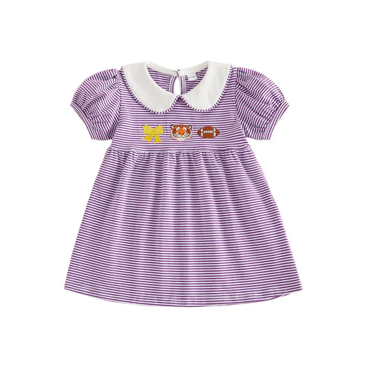 Front view of the toddler girls purple and white striped game day dress featuring a white Peter Pan collar and chest embroidery of a gold bow, tiger mascot, and a football on a white background.