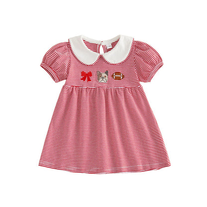 Front view of the toddler girls red and white striped game day dress featuring a classic white Peter Pan collar, short puffed sleeves, and chest embroidery of a red bow, bulldog mascot, and a football on a white background.