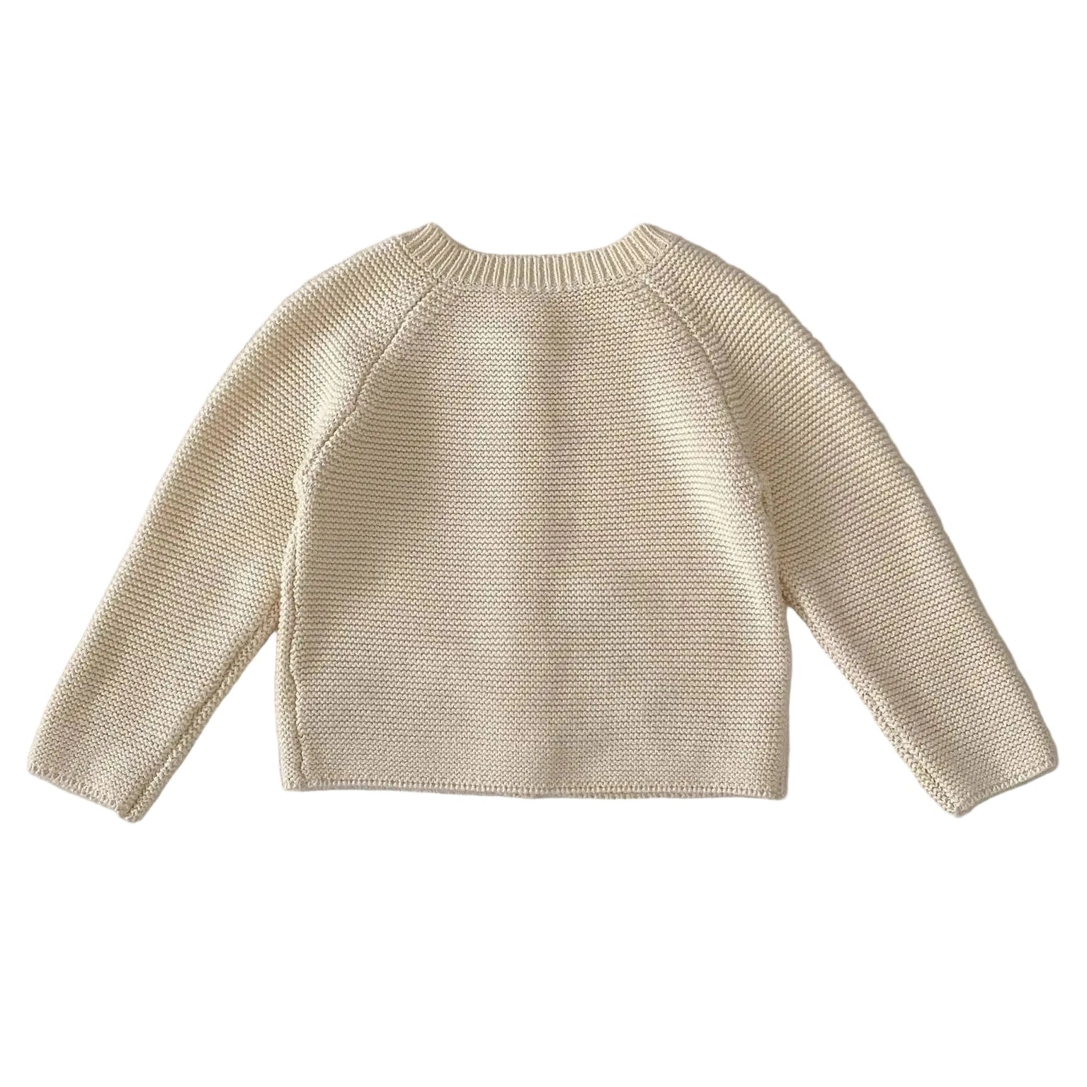 Clean back view of the plain cream-colored 100% cotton knit toddler cardigan sweater on a white background.