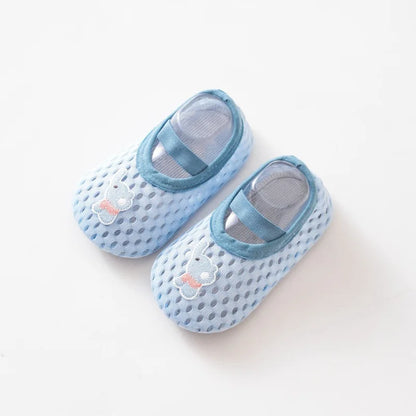 Soft blue toddler water shoes with an embroidered elephant patch and anti-slip grip.