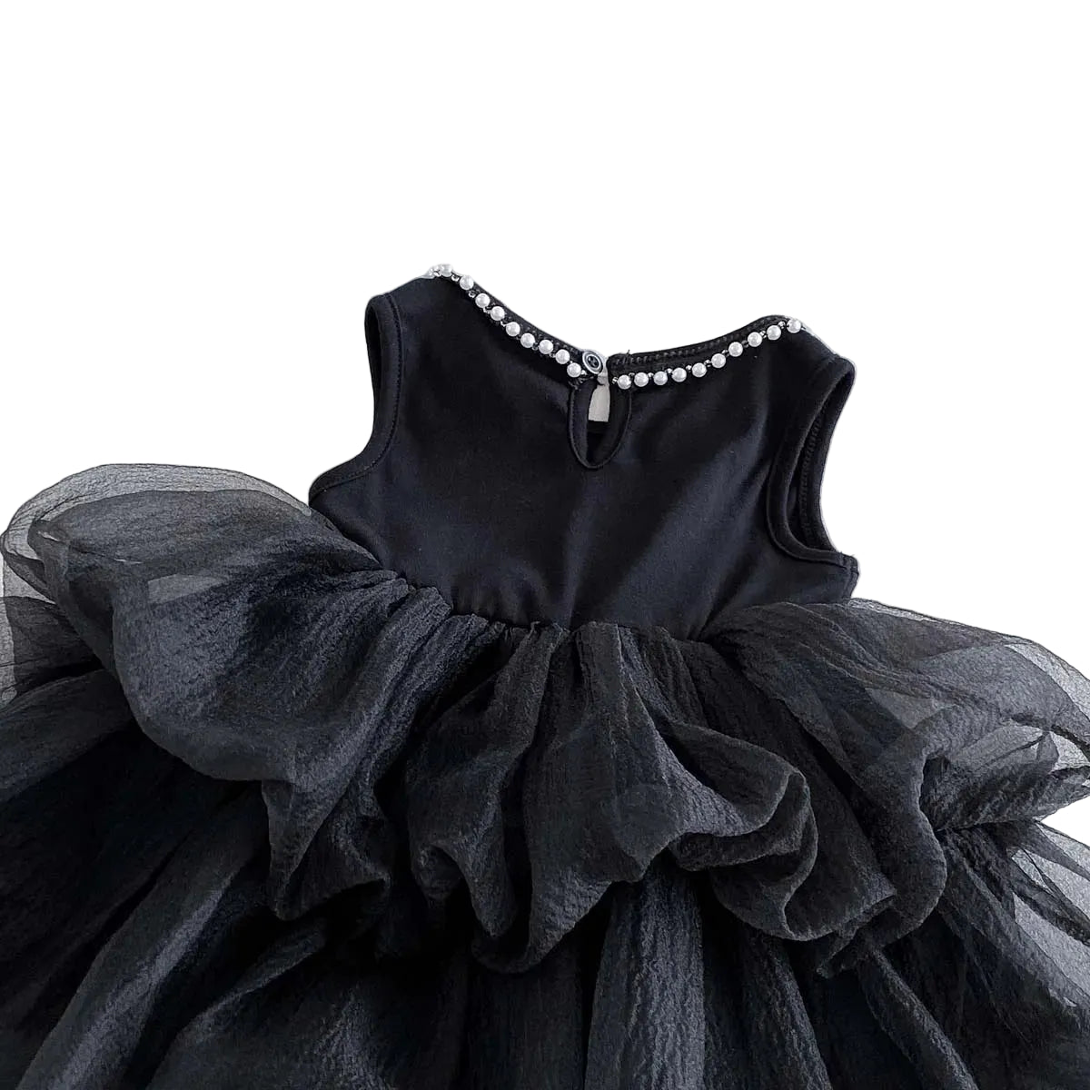 A side-profile view of the dress skirt, clearly showing the multiple gathered and layered tulle tiers and ruffles creating its volume.
