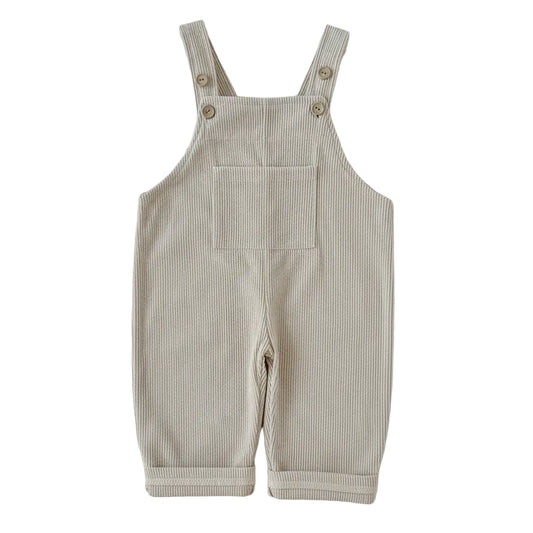 Front view of Kidsely neutral beige corduroy overalls for babies and toddlers, featuring a square neckline and front pocket.
