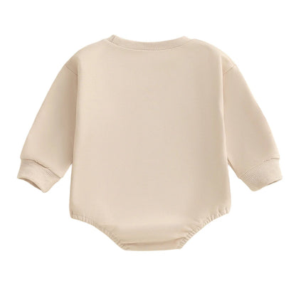 Back view of the solid beige long-sleeve baby sweatshirt bubble romper.