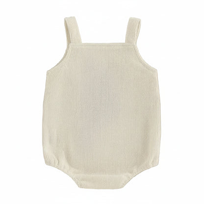 Back view of the cream-colored ribbed corduroy baby romper showing the clean, sleeveless design.
