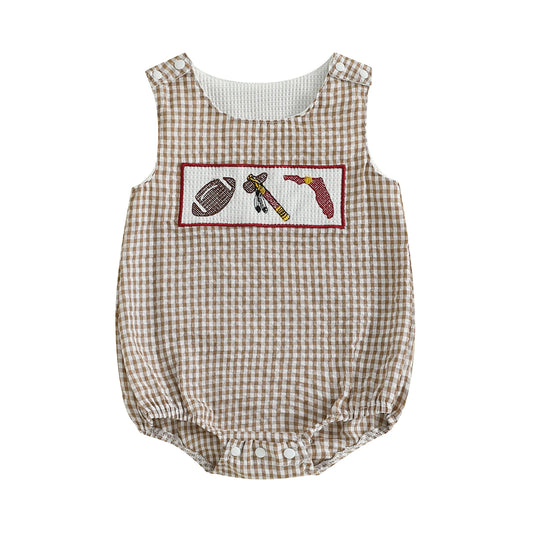 Front view of a tan and white seersucker gingham baby bubble romper featuring a hand-smocked chest plate with a football, a traditional native tomahawk axe, and a garnet Florida state map outline on a solid white background.