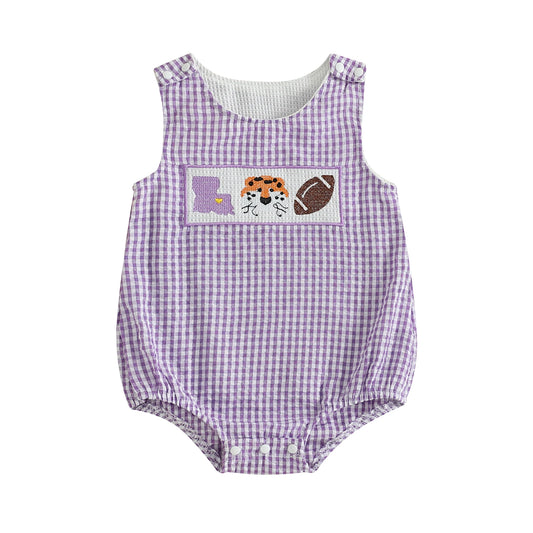 Front view of a purple and white seersucker gingham baby bubble romper featuring a hand-smocked chest plate with a purple Louisiana state map, a friendly orange tiger face, and a football on a solid white background.