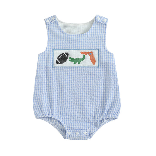 Front view of a light blue and white seersucker gingham baby bubble romper featuring a hand-smocked chest plate with a football, green alligator, and orange Florida state map on a solid white background.
