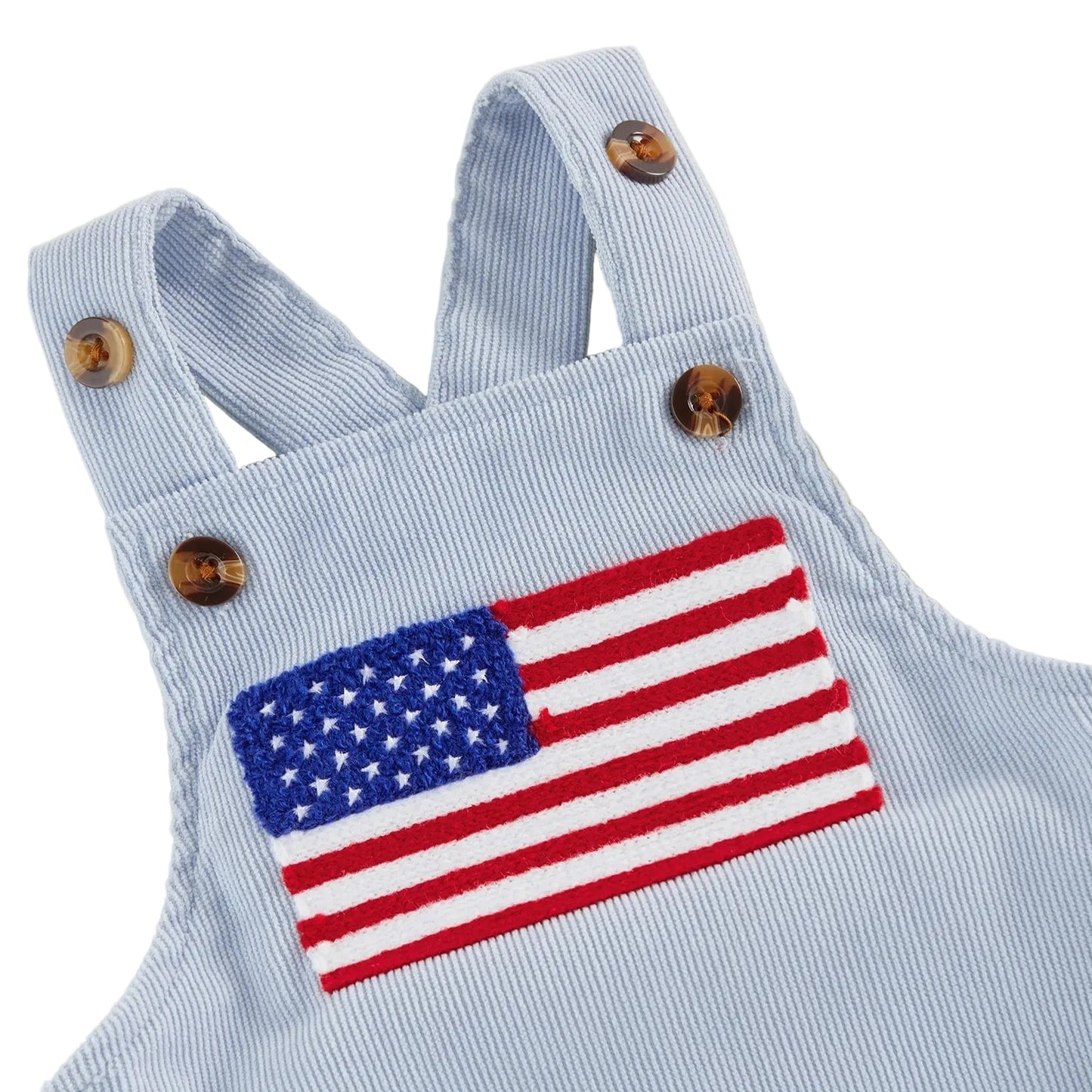 Close-up shot of the vibrant red, white, and blue American flag patch stitched onto a light blue ribbed baby romper.