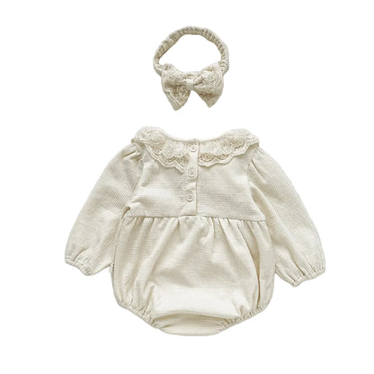 Back view of complete outfit set featuring the cream vintage style baby girl waffle knit long sleeve bubble romper and matching headband.