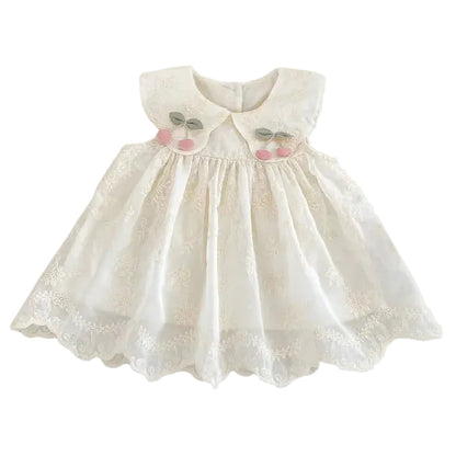 Sleeveless ivory cream vintage-inspired baby and toddler girls cotton dress with full-skirt floral embroidery, a large Peter Pan collar, and pink cherry appliqués. Shown as a front view flat lay on a solid white background.