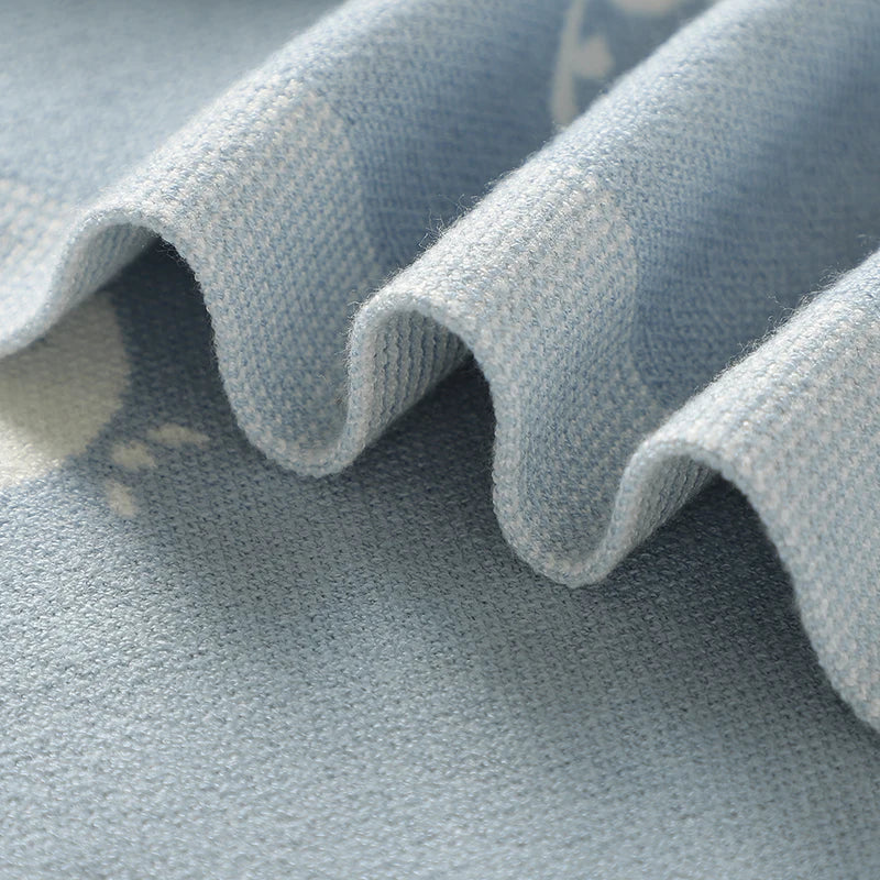 Close-up of soft, wavy folds in the viscose knit baby blanket demonstrating lightweight texture