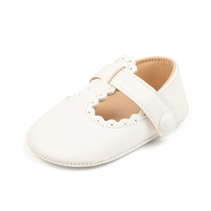 Single white PU leather baby girl T-strap crib shoe viewed from a front angle.