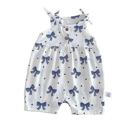 White baby girl bubble romper with a blue bow print and adjustable shoulder tie-straps on a white background.