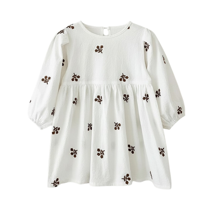 Flat lay of the crisp white long-sleeve cotton toddler dress featuring brown floral embroidery.
