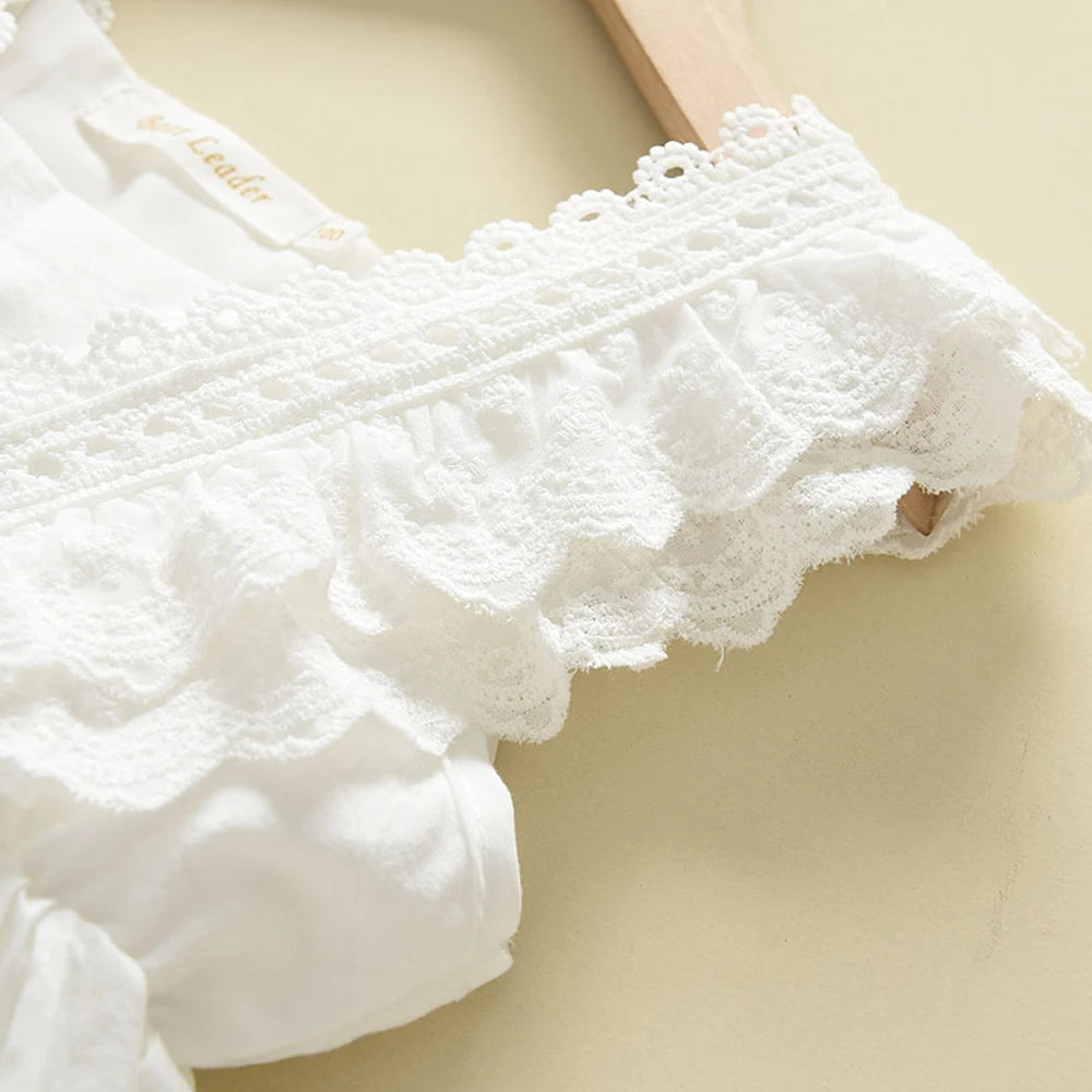 Detailed close-up view of the delicate white lace trim on the ruffle flutter sleeves of the dress.