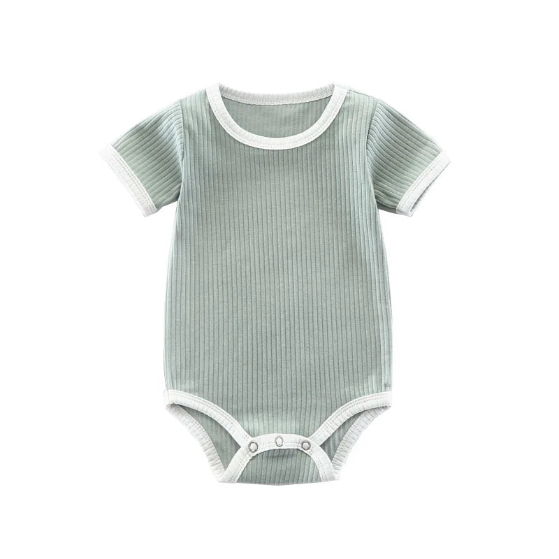 Full front view of the green ribbed cotton infant bodysuit with white contrast binding.