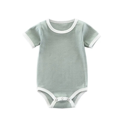 Full front view of the green ribbed cotton infant bodysuit with white contrast binding.