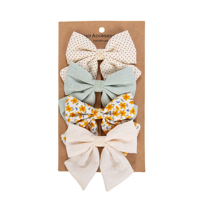 Kidsely Wildflower Mint oversized hair clips featuring sage green, wildflower prints, and ivory linen textures.