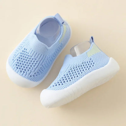 Kidsley Cloud Blue breathable mesh knit baby sneaker with non-slip white rubber sole and mint green heel accent.