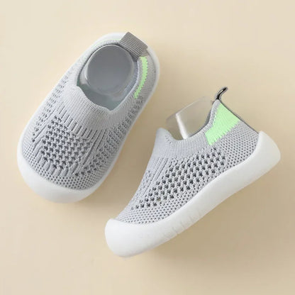 Kidsley Heather Grey slip-on toddler sneaker with breathable knit fabric and lime green safety heel accent.