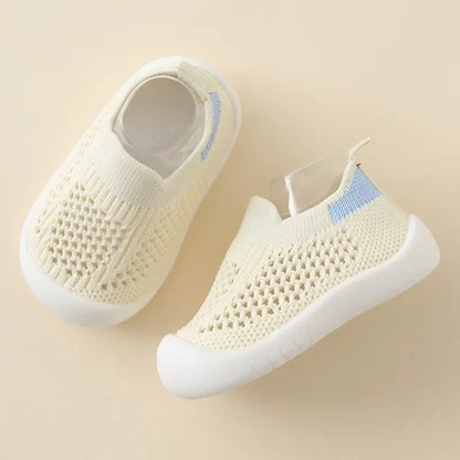 Kidsley Oatmeal cream-colored neutral toddler sneaker in breathable mesh knit with ivory heel pull-tab.