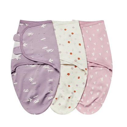 Lavender Sky collection swaddles featuring purple seagull, cream floral, and pink heart prints.